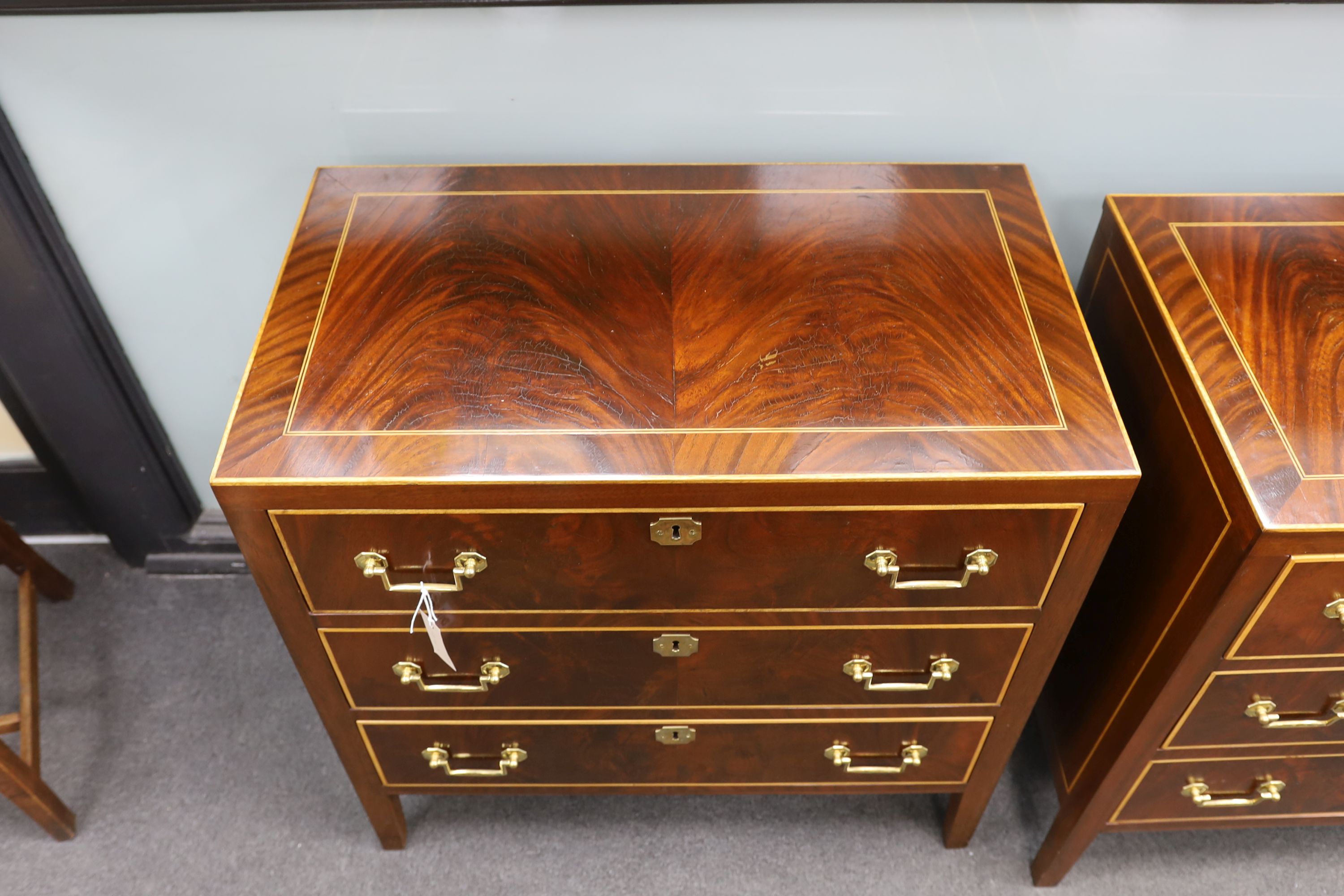 A pair of George IV style inlaid mahogany three drawer chests, width 79cm, depth 46cm, height 78cm